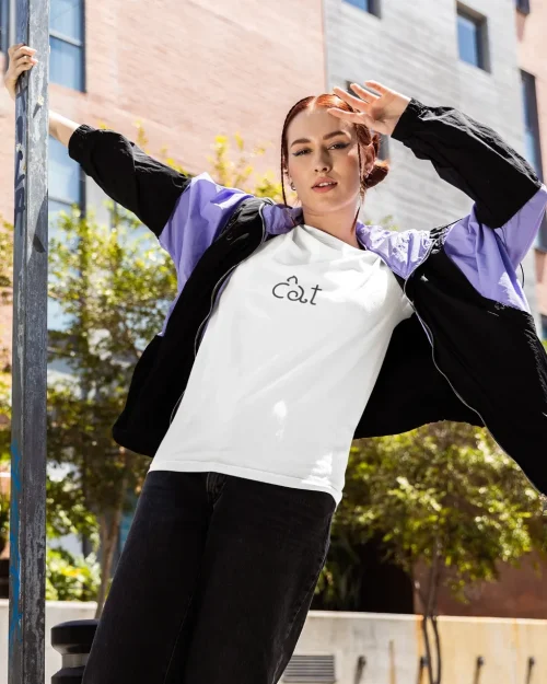 model wearing white t-shirt with cat design