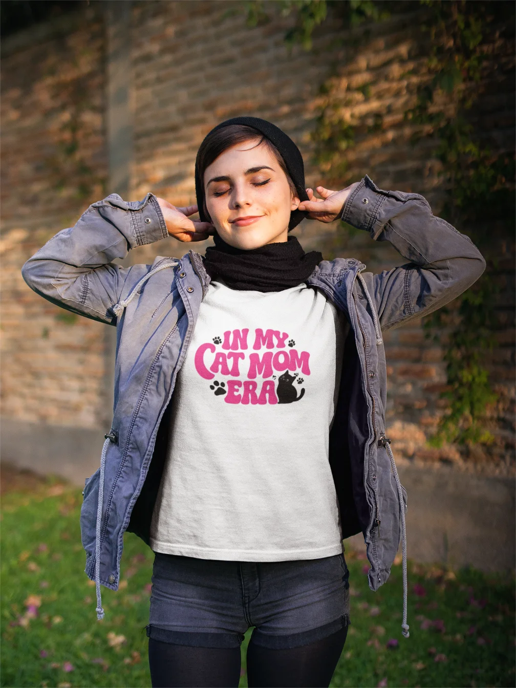 model wearing white t-shirt with in my cat mom era design